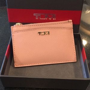Tumi leather credit card holder with key ring.